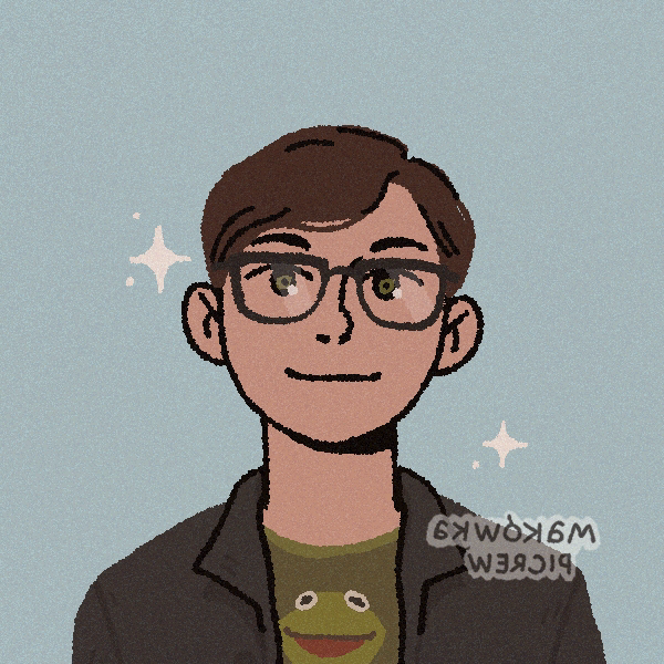 It's me! A dark-haired man wearing rectangular glasses, a frog t-shirt, and black jacket+beanie